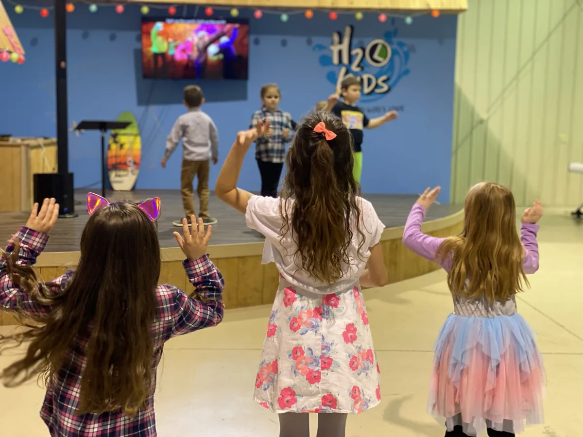 H2O Kids worshipping during children's service